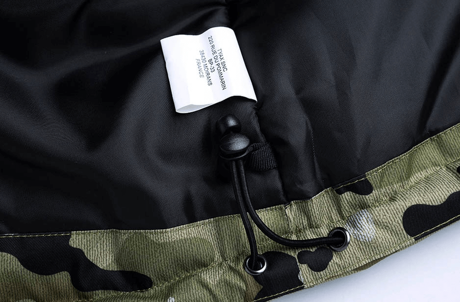 Close-up of drawstring and label inside camouflage waterproof men's snowboard jacket SF0899, highlighting high-quality craftsmanship.
